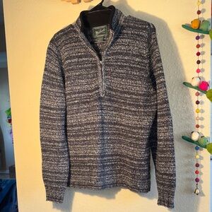 EUC Woolrich quarter-zip sweater is a vintage-inspired piece often referred to a